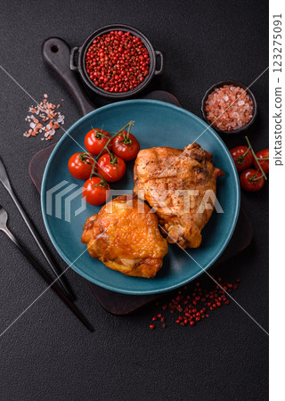 Delicious juicy chicken thighs baked with salt, spices and herbs 123275091
