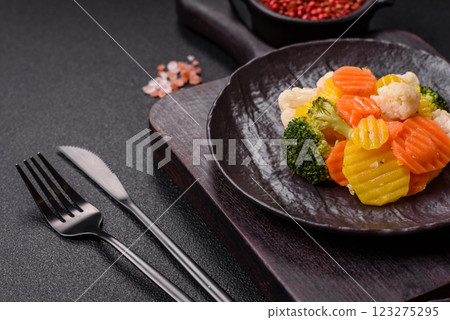 Delicious fresh vegetables steamed carrots, broccoli, cauliflower Delicious fresh vegetables steamed carrots, broccoli, cauliflower 123275295
