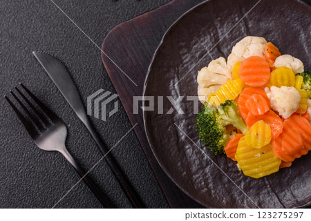 Delicious fresh vegetables steamed carrots, broccoli, cauliflower Delicious fresh vegetables steamed carrots, broccoli, cauliflower 123275297