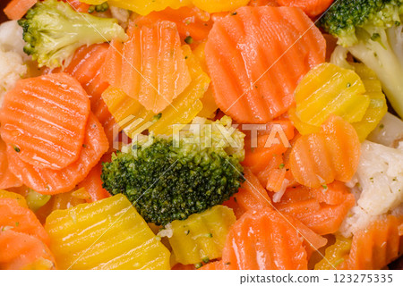 Delicious fresh vegetables steamed carrots, broccoli, cauliflower Delicious fresh vegetables steamed carrots, broccoli, cauliflower 123275335