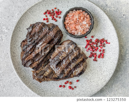 Grilled beef steak with salt, spices and herbs Grilled beef steak with salt, spices and herbs 123275350