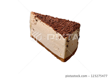 Slice of sweet cheesecake sprinkled with chopped chocolate Slice of sweet cheesecake sprinkled with chopped chocolate 123275477