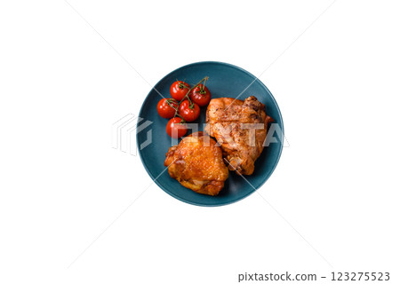 Delicious juicy chicken thighs baked with salt, spices and herbs Delicious juicy chicken thighs baked with salt, spices and herbs 123275523