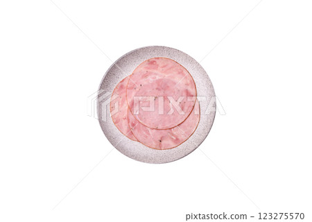 Smoked ham with salt, spices and herbs cut into round slices Smoked ham with salt, spices and herbs cut into round slices 123275570
