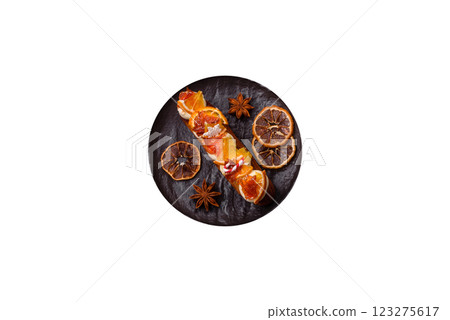 Delicious sweet eclair with chocolate filling, covered with cream 123275617