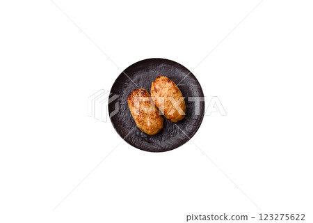 Delicious fresh fried minced fish cutlets with spices and herbs Delicious fresh fried minced fish cutlets with spices and herbs 123275622
