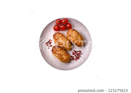 Delicious fresh fried minced fish cutlets with spices and herbs Delicious fresh fried minced fish cutlets with spices and herbs 123275623