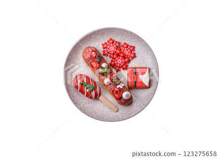 Sweet eclair with chocolate filling, decorated for Christmas 123275658