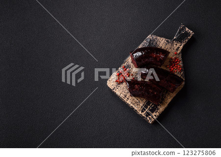 Delicious black blood sausage or black pudding with spices and herbs Delicious black blood sausage or black pudding with spices and herbs 123275806