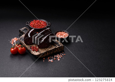 Delicious black blood sausage or black pudding with spices and herbs Delicious black blood sausage or black pudding with spices and herbs 123275814