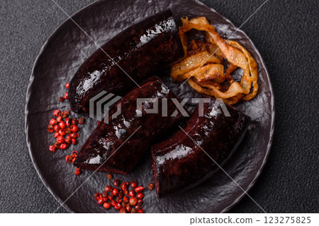 Delicious black blood sausage or black pudding with spices and herbs Delicious black blood sausage or black pudding with spices and herbs 123275825