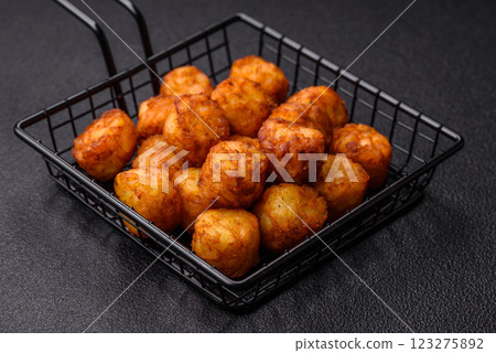 Delicious fried potato balls or croquettes with salt, spices and herbs Delicious fried potato balls or croquettes with salt, spices and herbs 123275892