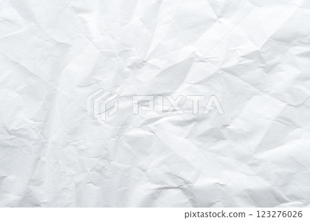 Textured crumpled white paper background with creases and wrinkles 123276026