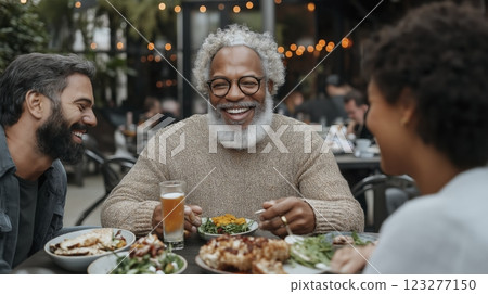 Laughter and joy shared among friends at a cozy outdoor dining spot during an early evening gathering. Generative AI 123277150
