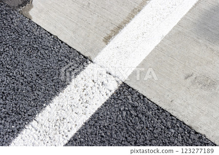 White lines on the road, the boundary between concrete and asphalt White lines on the road, the boundary between concrete and asphalt 123277189