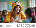 Cheerful Teacher Wearing Lion Costume Engaging Children in Creative Learning 123277340