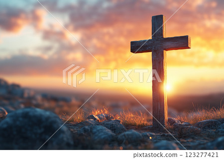 Crucifix with illuminated background under a sunset sky Crucifix with illuminated background under a sunset sky 123277421