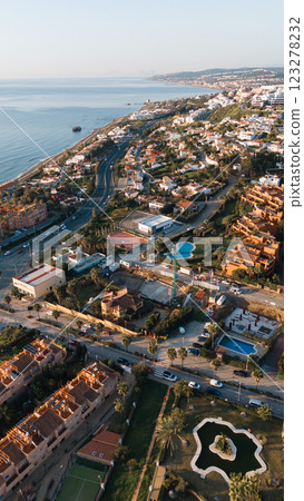 Coastal aerial view of sunny mediterranean town with roads and buildings 123278232