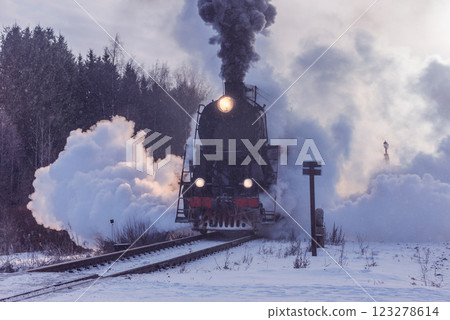 Retro steam train moves at winter morning. 123278614