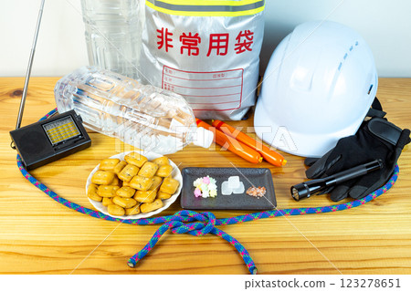 Contents of emergency evacuation bag and opened emergency food 123278651
