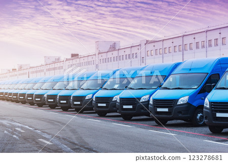 Freight trucks stand by the storage building. Freight trucks stand by the storage building. 123278681