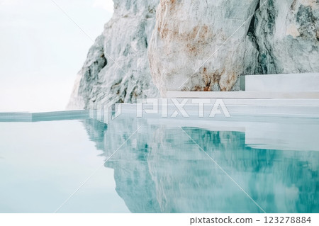Inviting crystal clear outdoor thermal baths nestled among white rocks offer a luxurious and relaxing spa experience 123278884