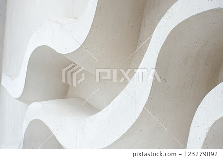 White wavy concrete wall creating abstract architectural design 123279092
