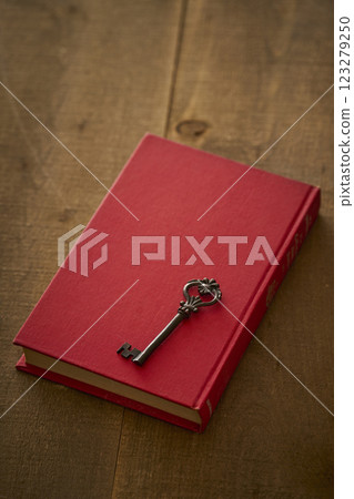 Image of antique book and key Image of antique book and key 123279250
