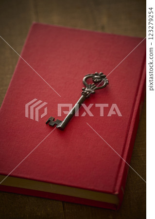 Image of antique book and key Image of antique book and key 123279254