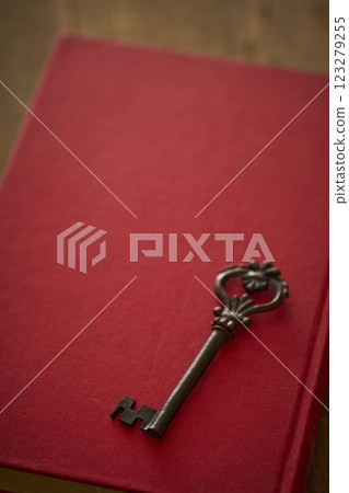 Image of antique book and key Image of antique book and key 123279255