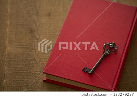 Image of antique book and key Image of antique book and key 123279257