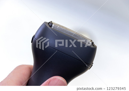 Hand-held electric shaver Hand-held electric shaver 123279345