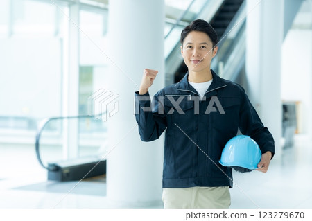 A businessman wearing work clothes A businessman wearing work clothes 123279670