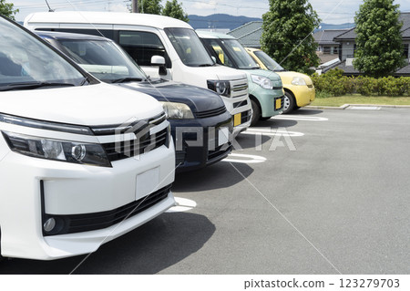 Passenger cars lining up in the parking lot 123279703