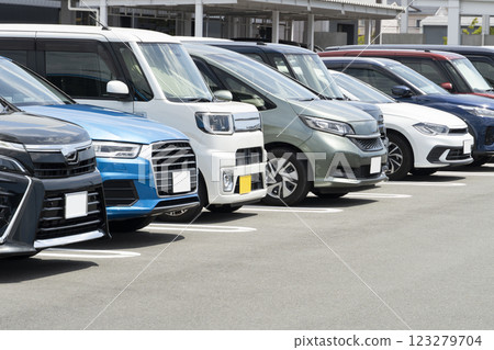 Passenger cars lining up in the parking lot Passenger cars lining up in the parking lot 123279704