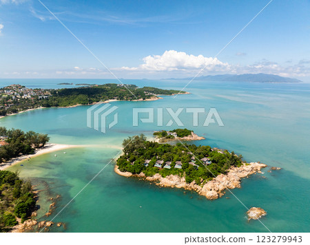 A scenic tropical peninsula surrounded by turquoise waters and covered with lush vegetation. Koh Samui, Thailand. A scenic tropical peninsula surrounded by turquoise waters and covered with lush vegetation. Koh Samui, Thailand. 123279943