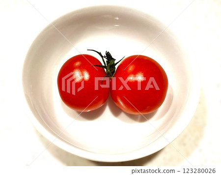 Two cherry tomatoes with their stems stuck together 1 123280026