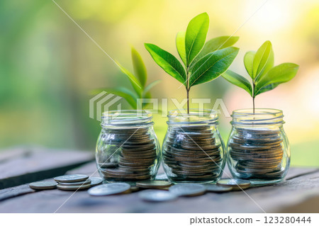 Growing investments in jars symbolize financial growth and sustainability 123280444