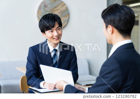 Businessmen having a meeting. Photo courtesy of Sky Perfect TV Tokyo Media Center. Businessmen having a meeting. Photo courtesy of Sky Perfect TV Tokyo Media Center. 123280782