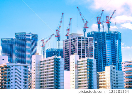 Tokyo cityscape in Japan: View of the Toyomi district and tower apartments under construction. In the foreground is the Toei Kachidoki 5-chome apartment building. 123281364