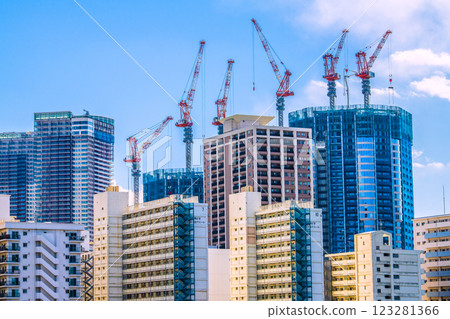 Tokyo cityscape in Japan: View of the Toyomi district and tower apartments under construction. In the foreground is the Toei Kachidoki 5-chome apartment building. Tokyo cityscape in Japan: View of the Toyomi district and tower apartments under construction. In the foreground is the Toei Kachidoki 5-chome apartment building. 123281366