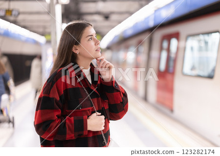 Woman changing to the subway Woman changing to the subway 123282174
