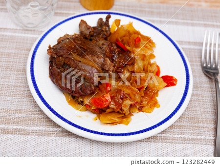 Pork cheek served with stewed cabbage Pork cheek served with stewed cabbage 123282449
