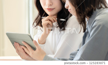 Two women/businesswomen having a meeting Two women/businesswomen having a meeting 123283871