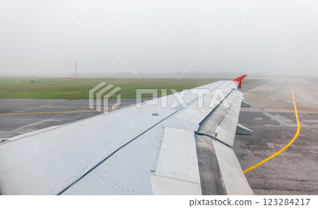 View from the airplane window during taking off on a clear summer morning. Yekaterinburg, Russia View from the airplane window during taking off on a clear summer morning. Yekaterinburg, Russia 123284217