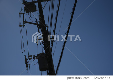 Blue sky and telephone pole Blue sky and telephone pole 123284583