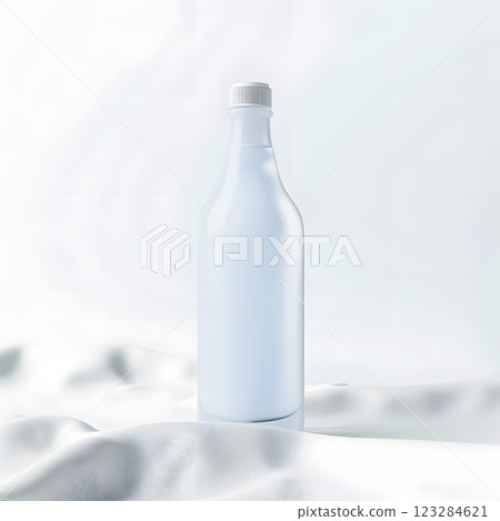 Glass bottle containing liquid placed on white cloth on table 123284621