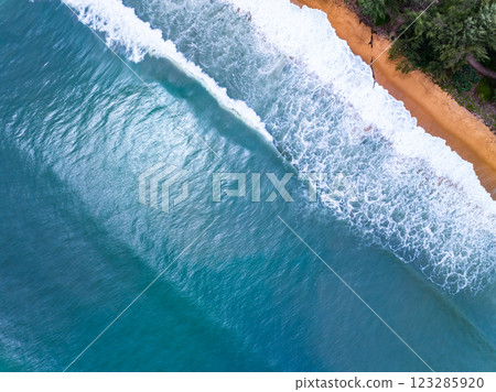 Summer seascape beautiful waves,Tropical sea water in sunny day, Top view from drone camera,Amazing ocean colorful nature background, Beautiful bright sea waves splashing on beach sand 123285920