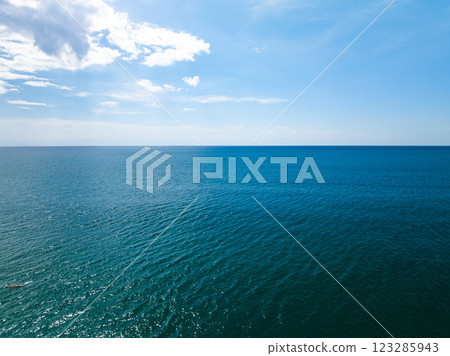 Aerial view of beautiful sea in summer season sky background,Drone view Waves water surface texture on sunny tropical ocean in Phuket island Thailand Aerial view of beautiful sea in summer season sky background,Drone view Waves water surface texture on sunny tropical ocean in Phuket island Thailand 123285943