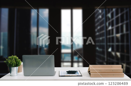 Workspace laptop computer, tablet, pencil and coffee cup with plant pot on office table. 123286489